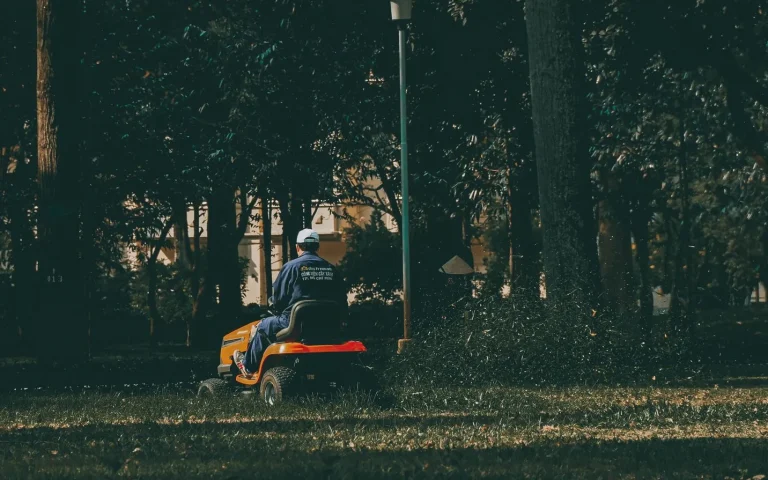Underside of a robot mower showing the blade disc and small razor blades