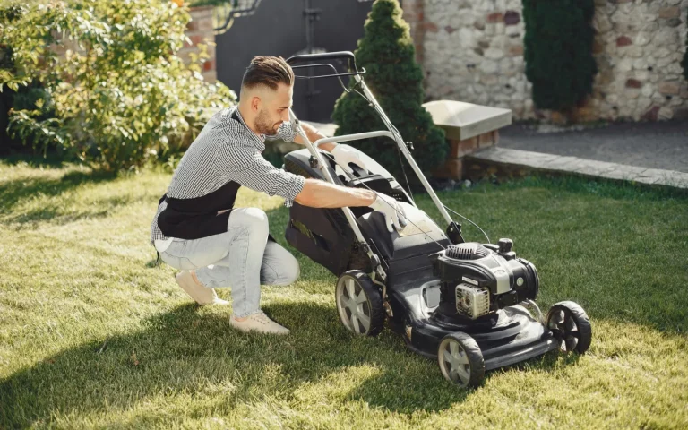 Several robot lawn mowers from different brands lined up on a green lawn for comparison