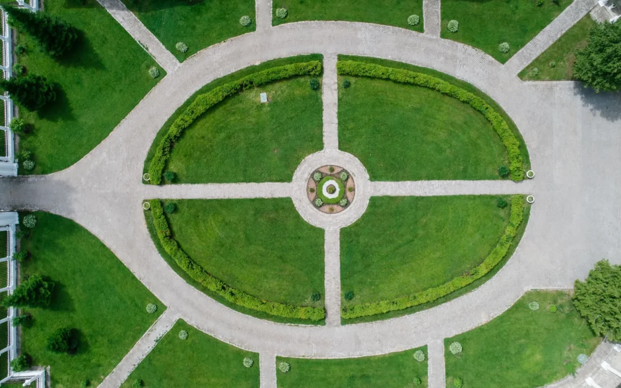 Green lawn with a garden path where a homeowner plans a robot mower purchase