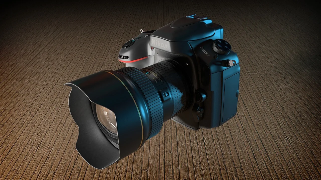 Close-up of a small camera lens on the front of a navigation robot mower