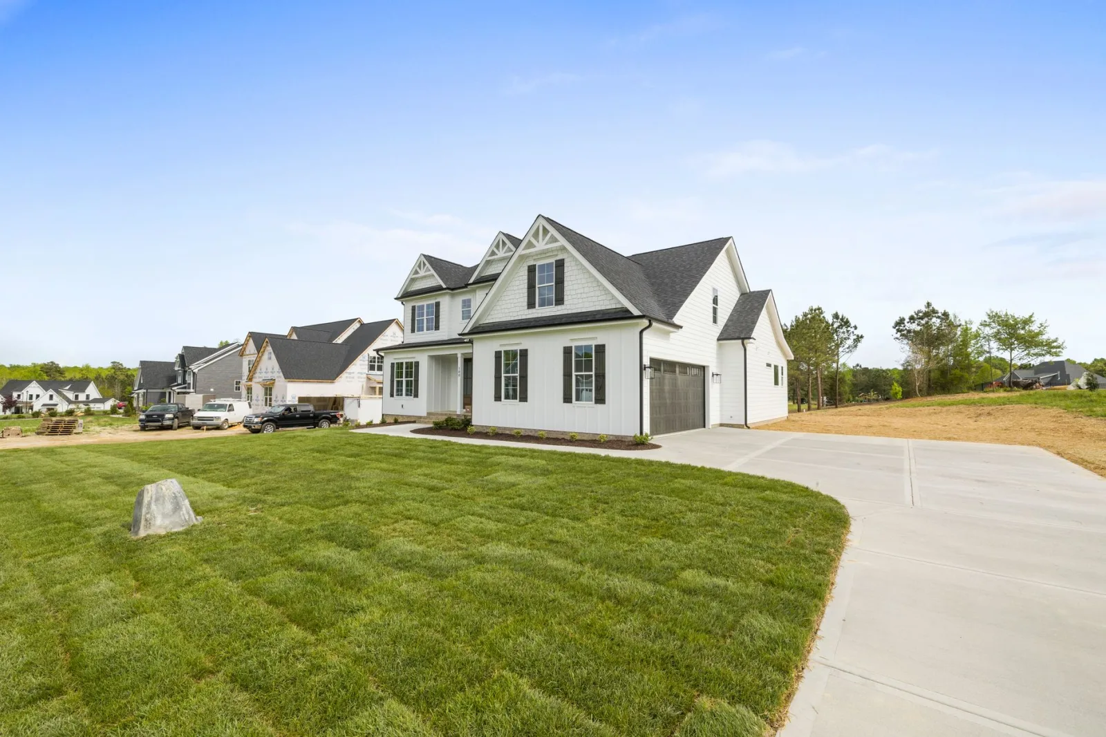 Robot mower parked on a fresh lawn at a newly moved-into house