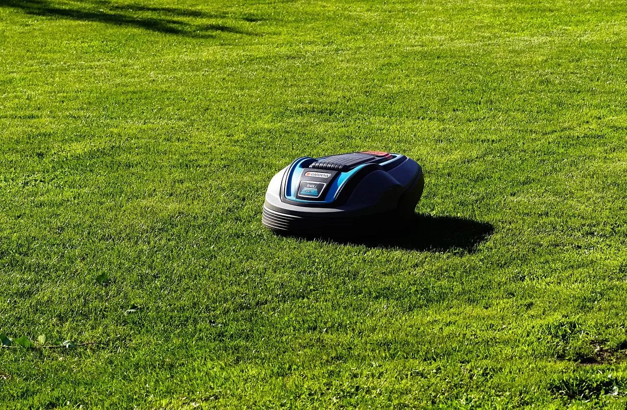 Close view of metal charging contacts on a robot mower docking station