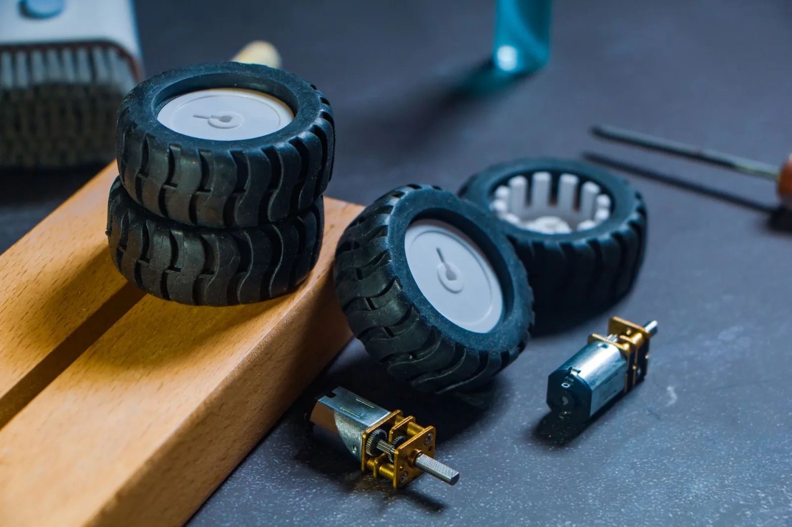 Detail of a robot mower body panel and collision sensor on green grass